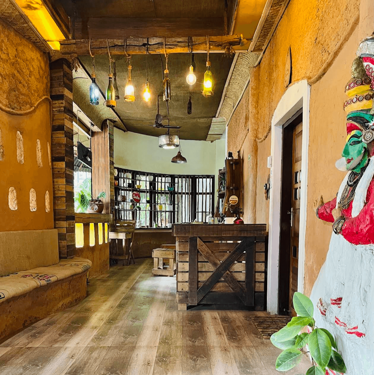 Hand-built mud and bamboo cafe structure in Ponkunnam