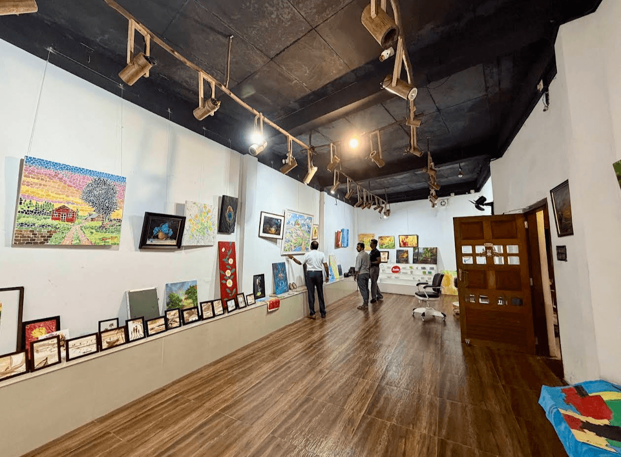 Artist painting on canvas inside the studio