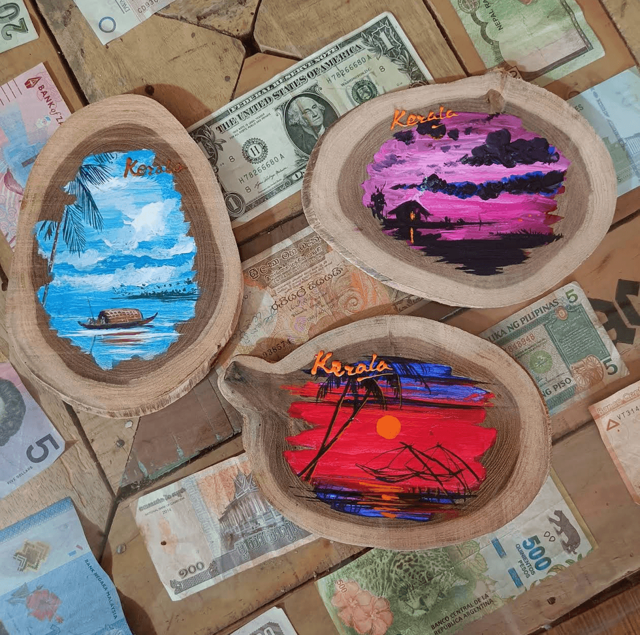 Collection of hand-painted mini landscapes on teak wood slices
